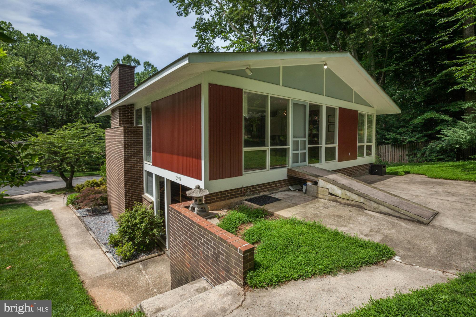 3946 Rickover Road Silver Spring, MD 20902 - Photo 26 of 30 a front view of a house with garden