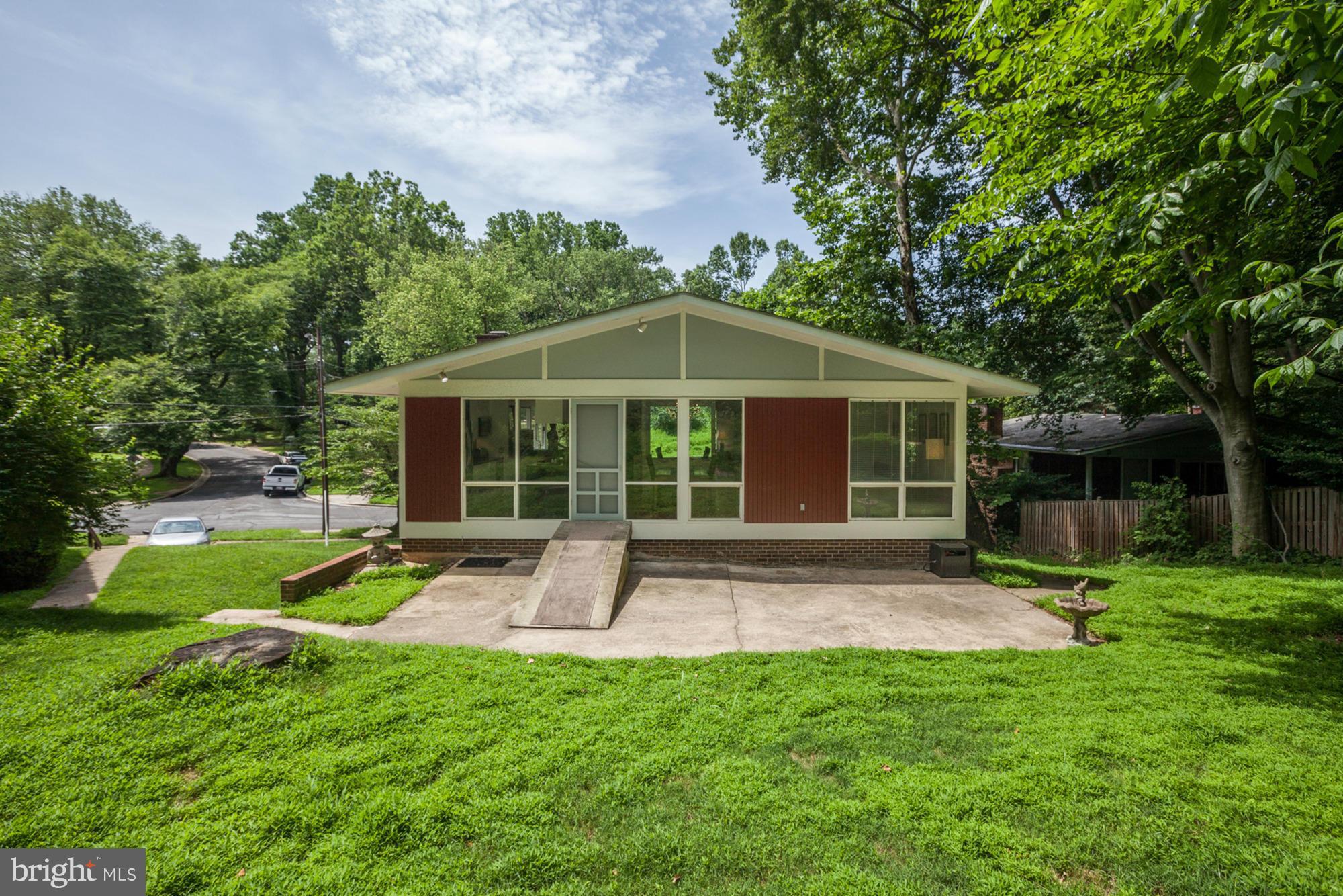 3946 Rickover Road Silver Spring, MD 20902 - Photo 28 of 30 a view of a house with backyard sitting area and garden