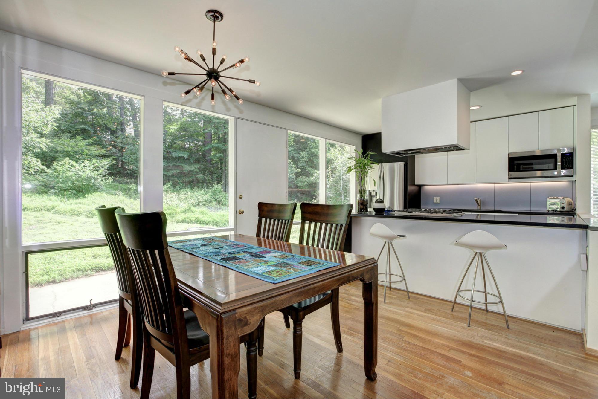 3946 Rickover Road Silver Spring, MD 20902 - Photo 6 of 30 a dining room with furniture window and wooden floor