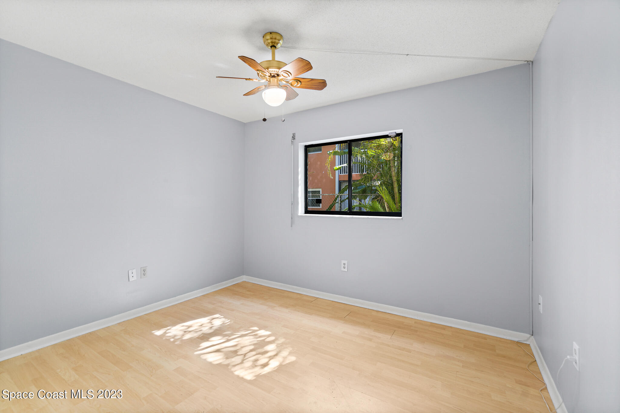 500 Catalina Road, Unit 103 Cocoa Beach, FL 32931 - Photo 18 of 28 a view of wooden floor in an empty room