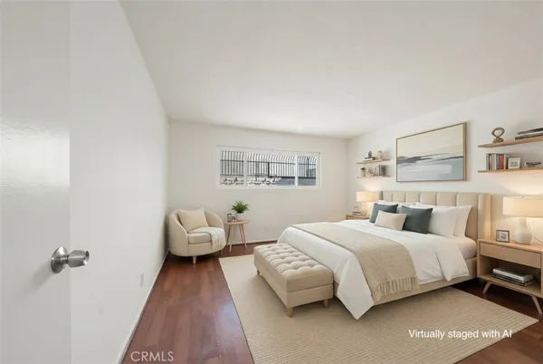 a bedroom with a bed and a couch