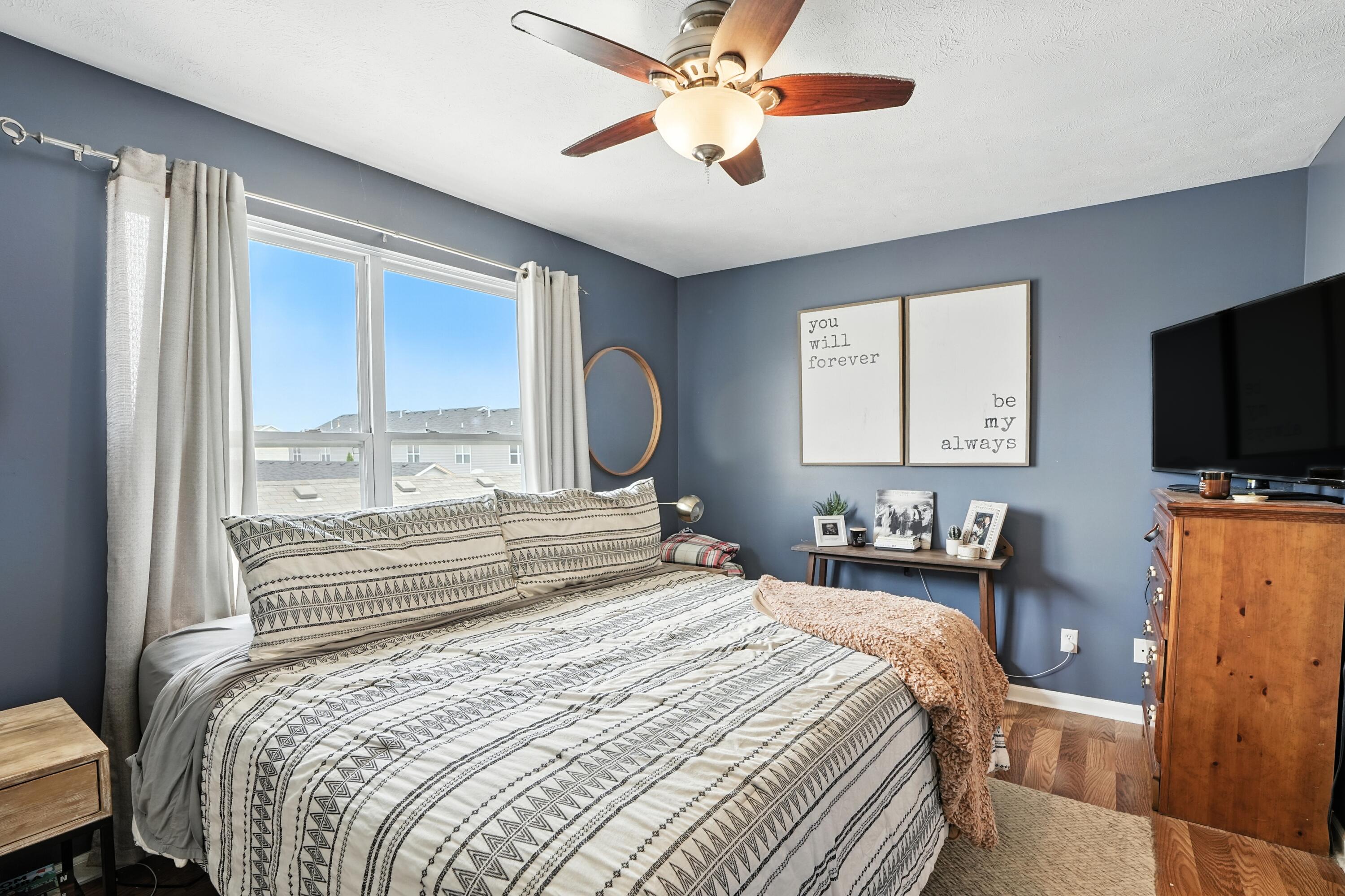922 East 115th Place Crown Point, IN 46307 - Photo 13 of 23 a bedroom with a bed and a flat screen tv