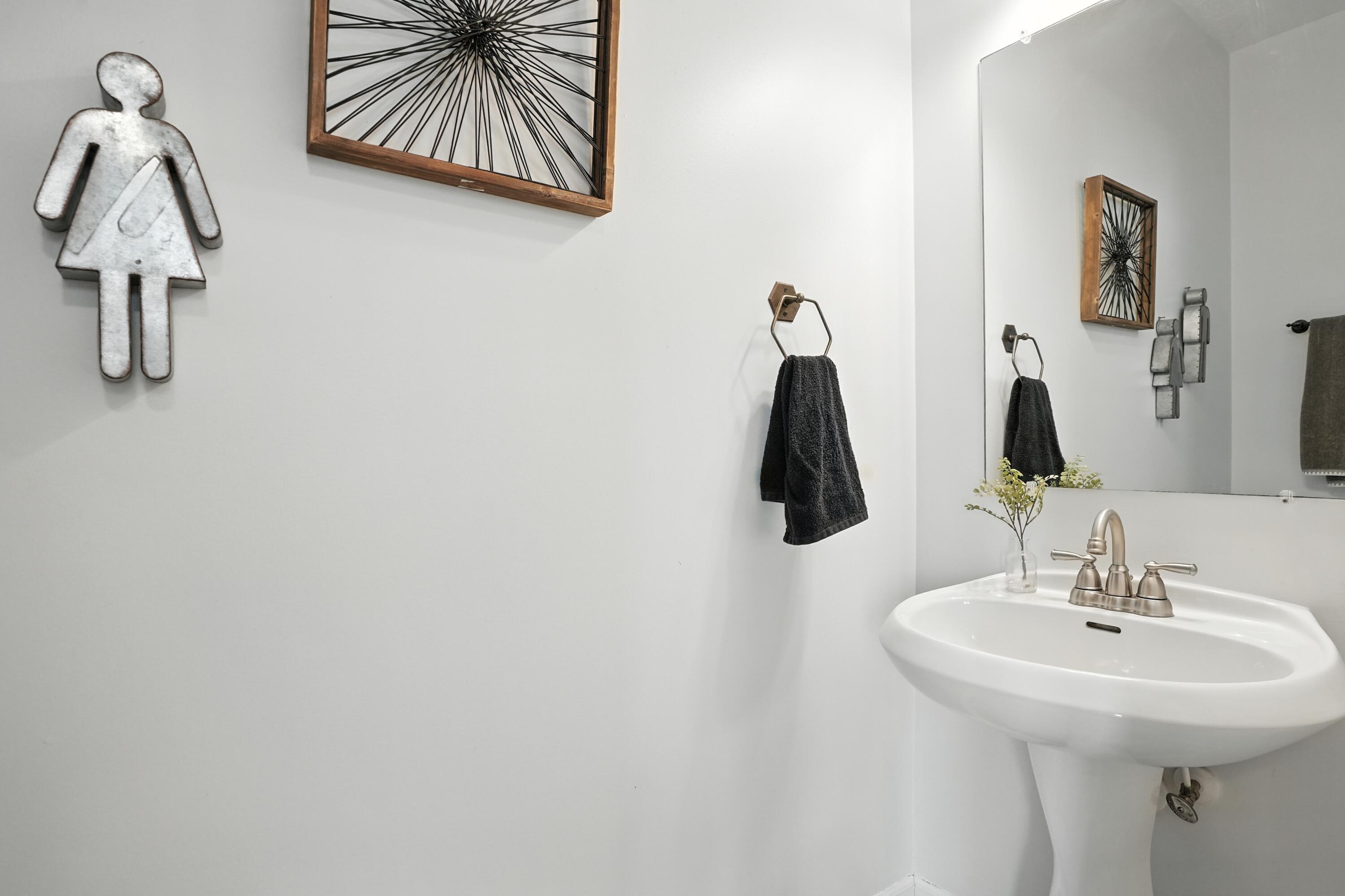 922 East 115th Place Crown Point, IN 46307 - Photo 16 of 23 a bathroom with a sink and mirror