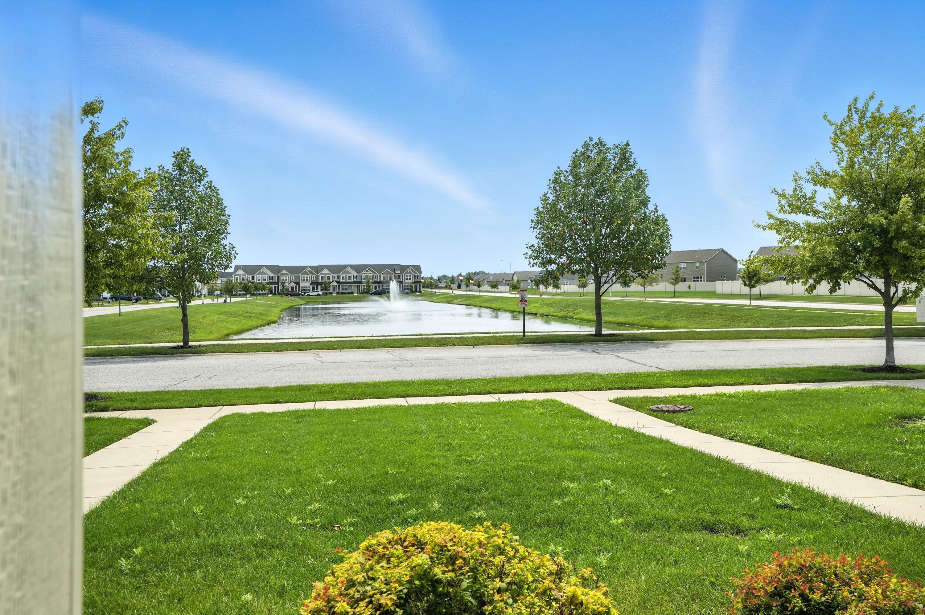 922 East 115th Place Crown Point, IN 46307 - Photo 2 of 23 a view of a golf course with a lake view