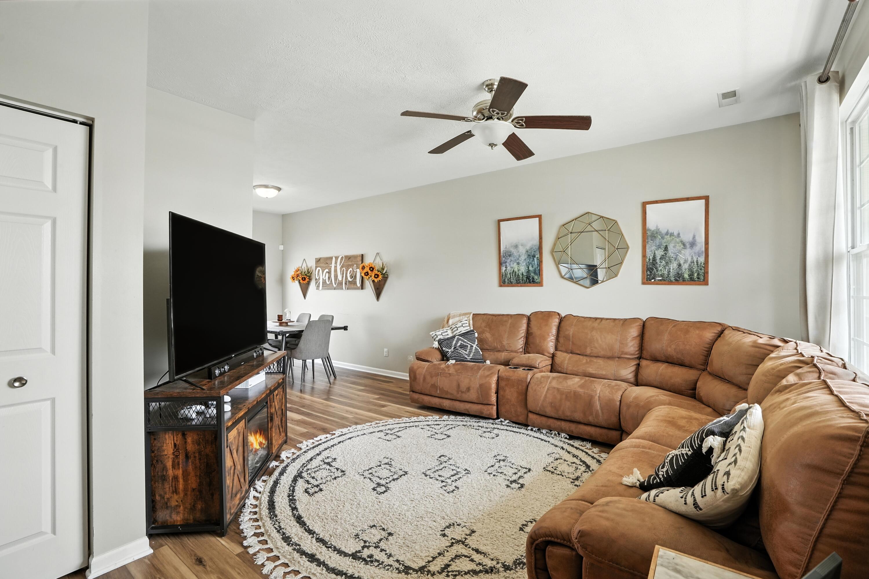 922 East 115th Place Crown Point, IN 46307 - Photo 3 of 23 a living room with furniture and a flat screen tv