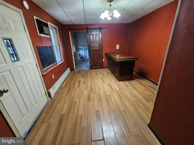 a view of a hardwood floor in a gallery