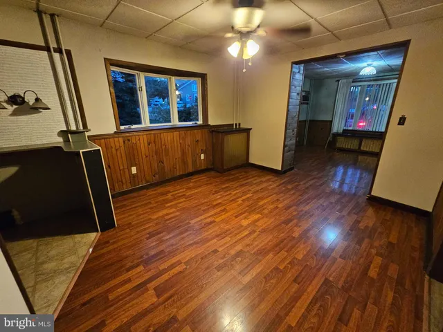a view of a living room with wooden floor