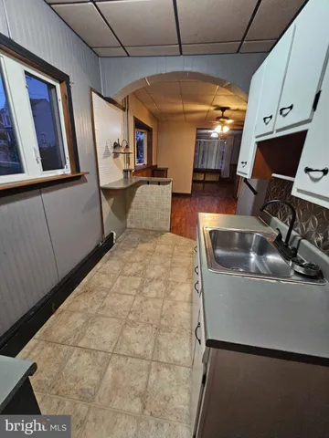 a room with lots of appliances and furniture