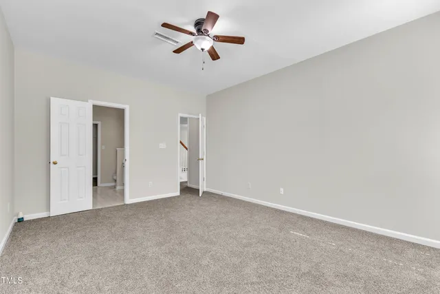 a view of a big room with carpet