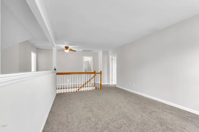 a view of a hallway with a window