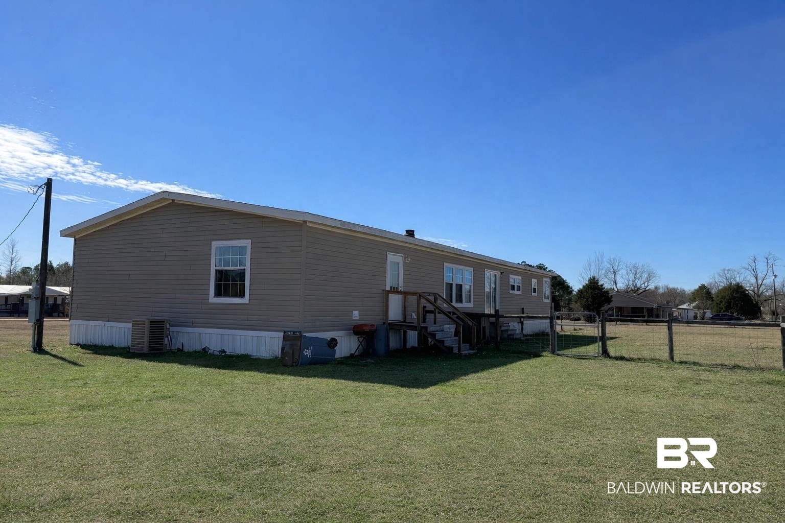 1064 Old Fannie Road Flomaton, AL 36441 - Photo 16 of 17 Rear view of house with a gate