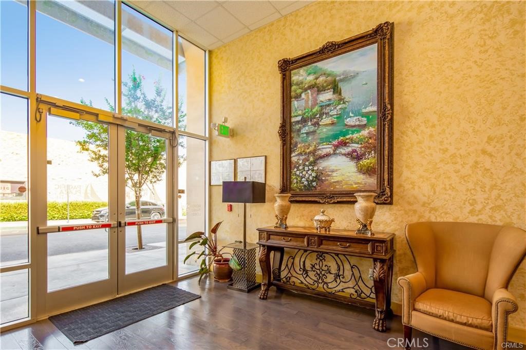 11 South 3rd Street, Unit 503 Alhambra, CA 91801 - Photo 4 of 13 a living room with furniture and a large window