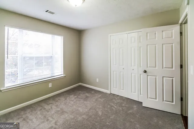 a bathroom with a toilet and a bathtub