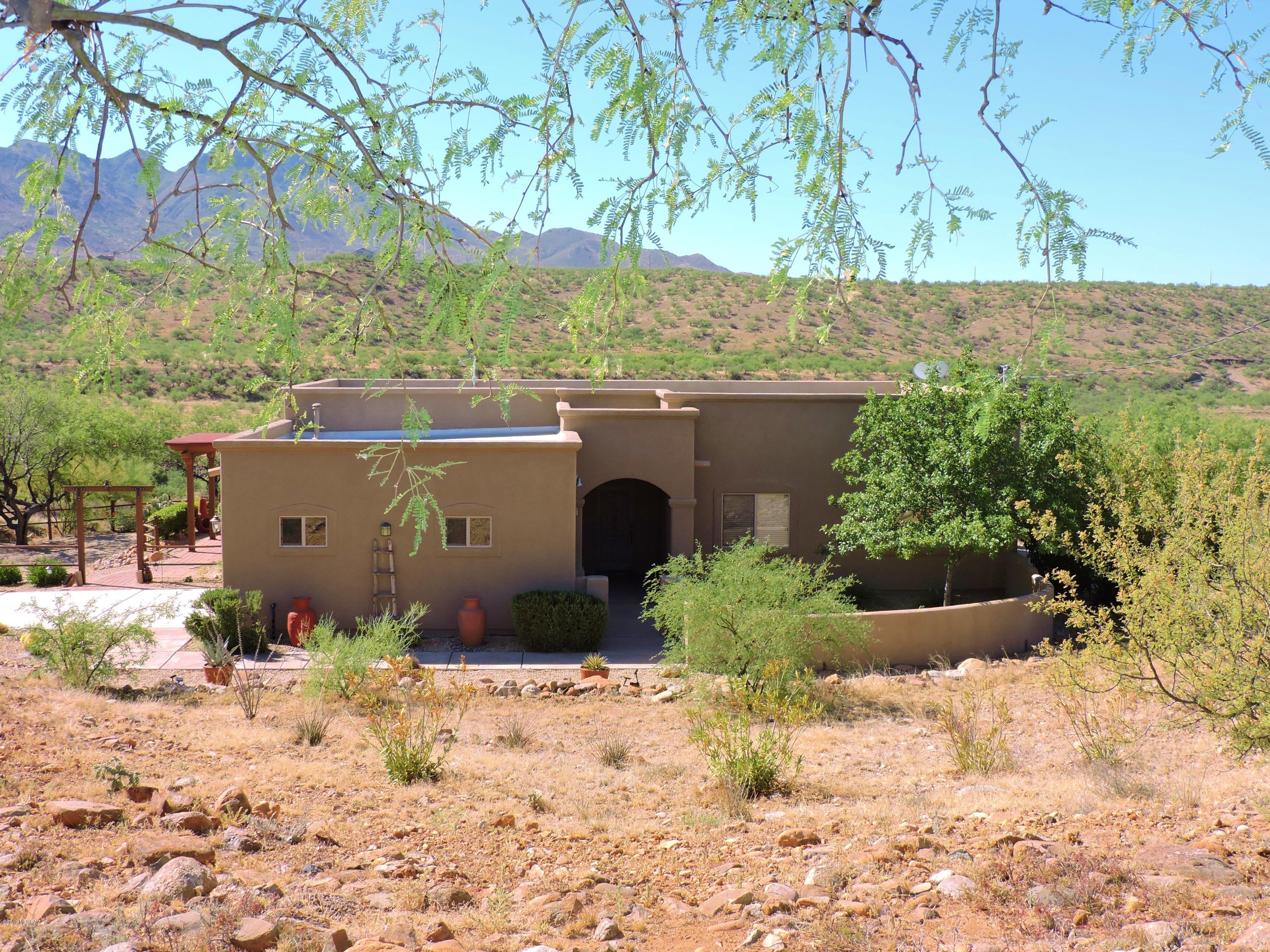 1786 Zimmer Court Rio Rico, AZ 85648 - Photo 1 of 42 a view of a house with a yard