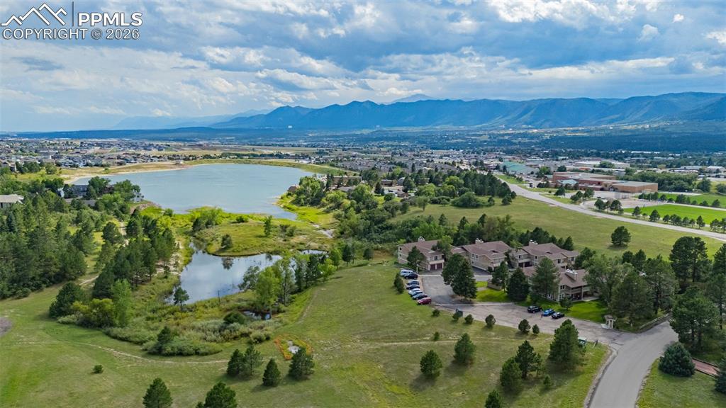 1679 Deer Creek Road Monument, CO 80132 - Photo 21 of 21 Drone / aerial view of a water and mountain view