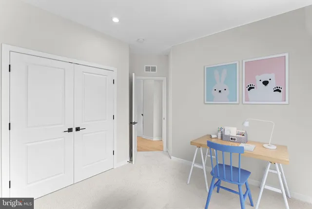 a view of a hallway with washer and dryer