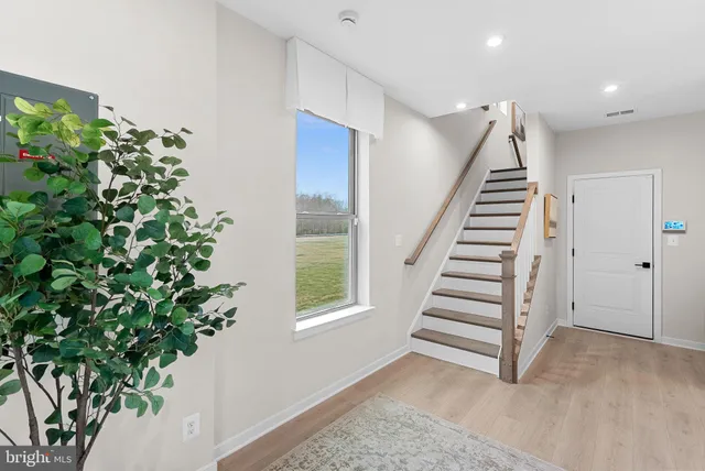 a view of entryway with stairs