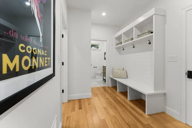 a hallway with table and flowerpot