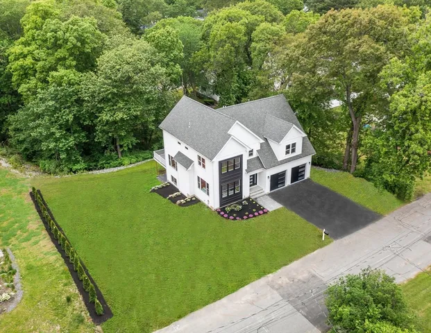 a aerial view of a house with a yard