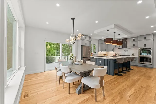 a view of a dining room with furniture window and outside view