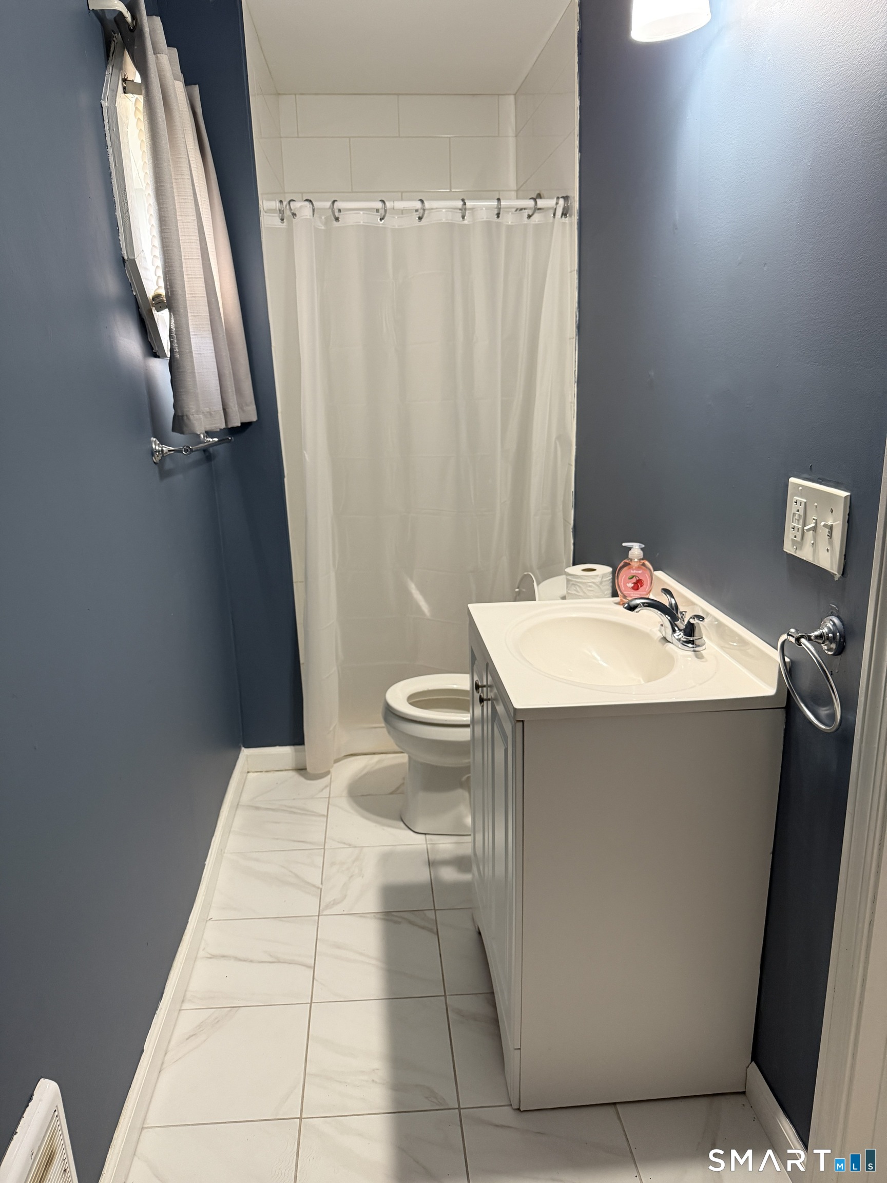 152 Scott Street Naugatuck, CT 06770 - Photo 3 of 7 a bathroom with a sink a toilet and a mirror
