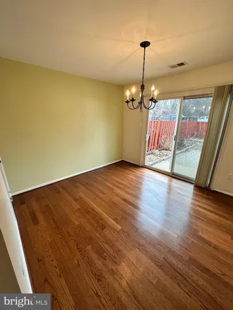 a view of a livingroom with wooden floor