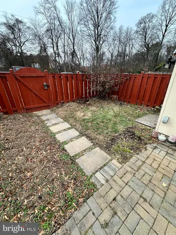 a view of a backyard of the house