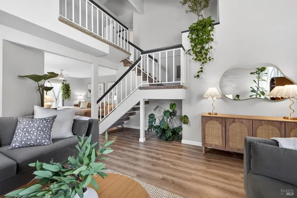 a view of entryway and hall with wooden floor