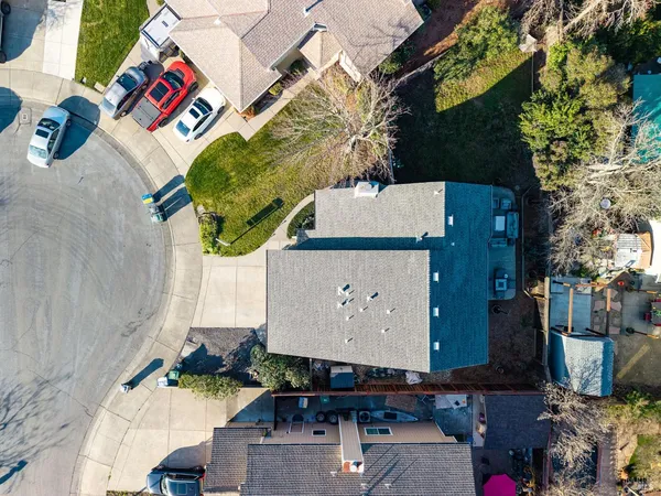 an aerial view of a house with swimming pool