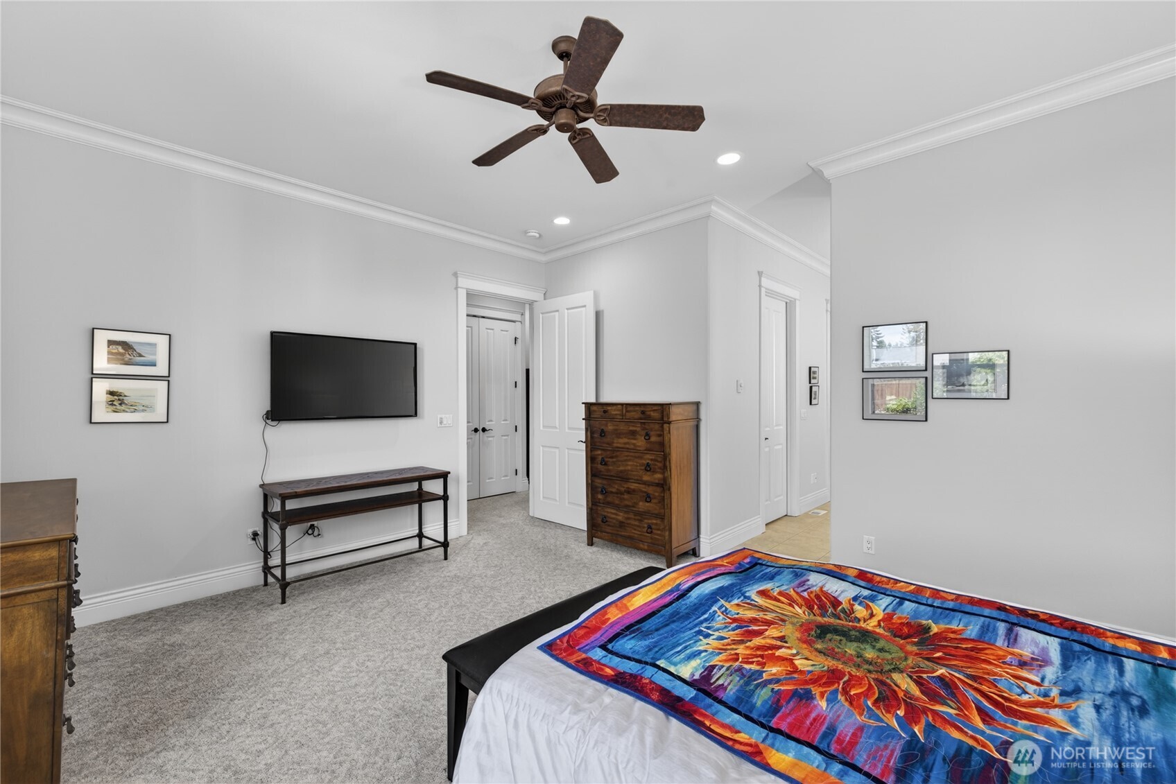 1908 29th Place Anacortes, WA 98221 - Photo 32 of 40 a bedroom with a bed and a flat screen tv