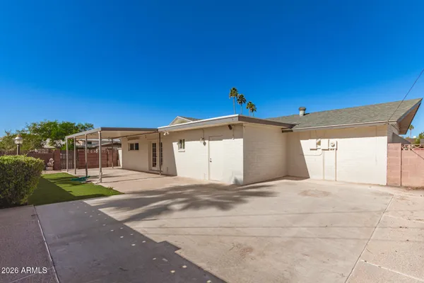 a house with a yard and a garage