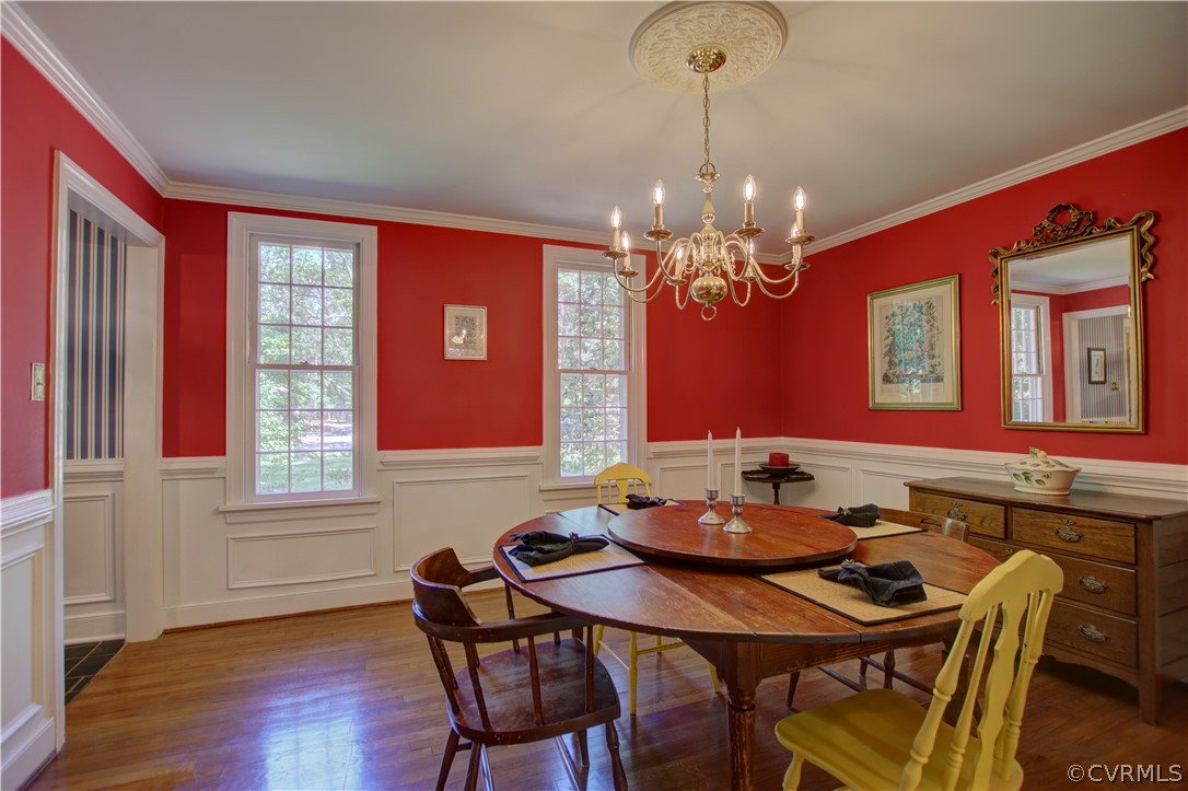 13711 Elmstead Road Midlothian, VA 23113 - Photo 12 of 47 a view of a dining room with furniture and chandelier