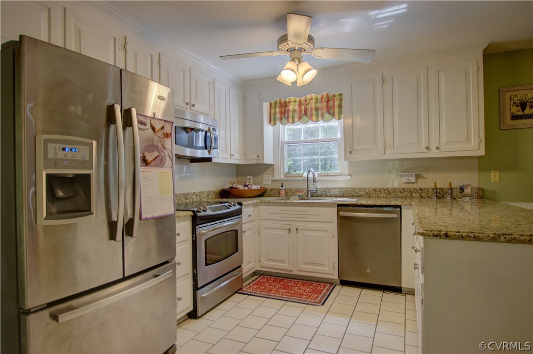 13711 Elmstead Road Midlothian, VA 23113 - Photo 13 of 47 a kitchen with stainless steel appliances granite countertop a refrigerator sink and stove