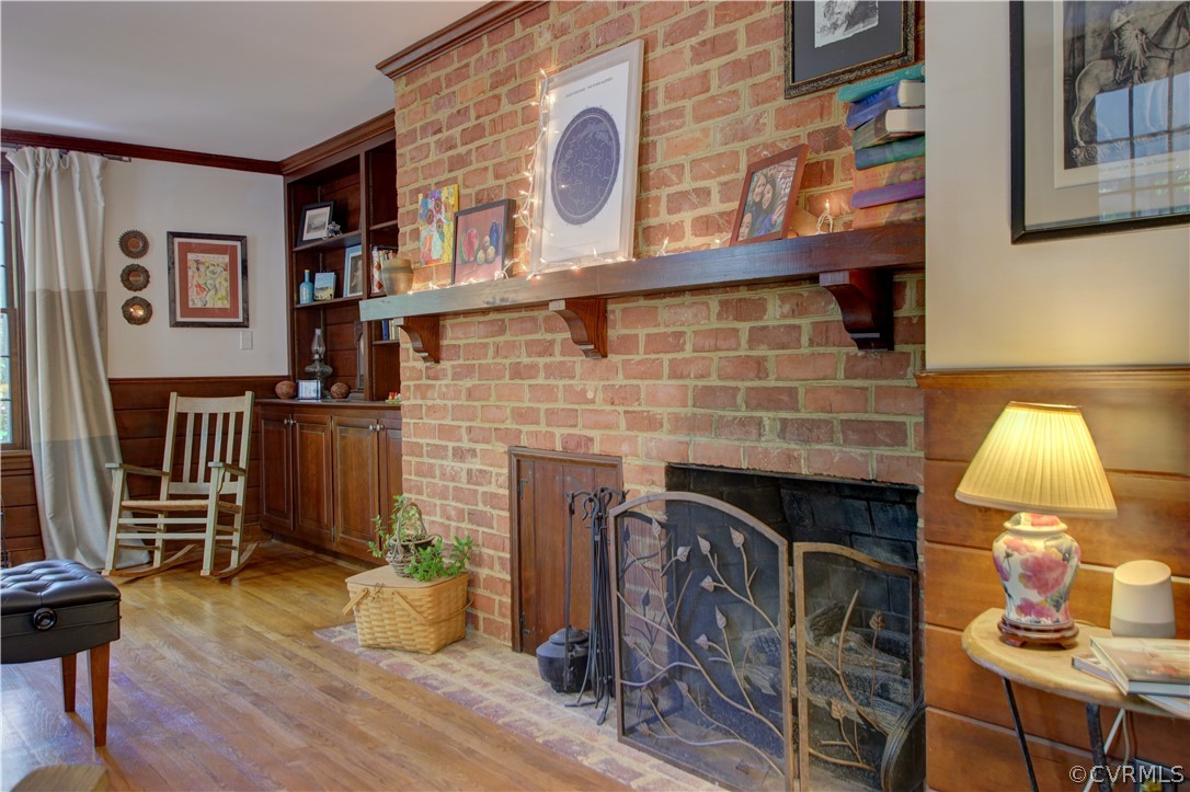 13711 Elmstead Road Midlothian, VA 23113 - Photo 20 of 47 a living room with fireplace furniture and a wooden floor