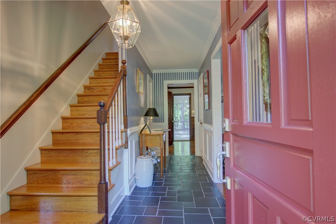 13711 Elmstead Road Midlothian, VA 23113 - Photo 7 of 47 a view of staircase with lots of frames on wall and a large window