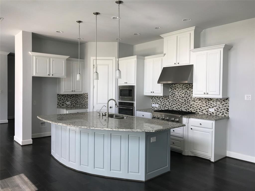 6321 Smithwick Drive McKinney, TX 75070 - Photo 1 of 1 a kitchen with stainless steel appliances granite countertop a stove a sink and a refrigerator