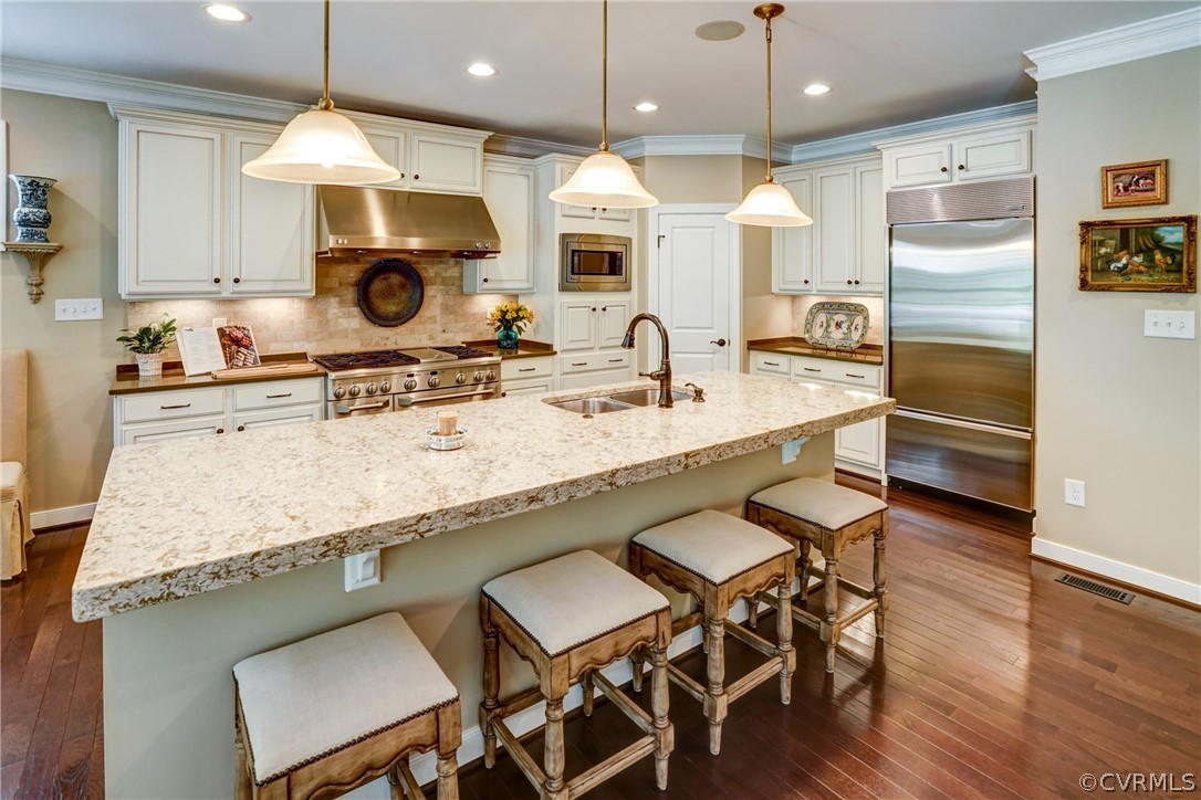 165 Button Bush Road Richmond, VA 23238 - Photo 12 of 50 a large kitchen with a table and chairs in it
