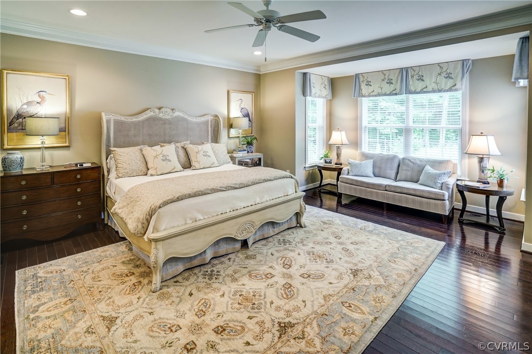 165 Button Bush Road Richmond, VA 23238 - Photo 25 of 50 a spacious bedroom with a bed a couch and large window