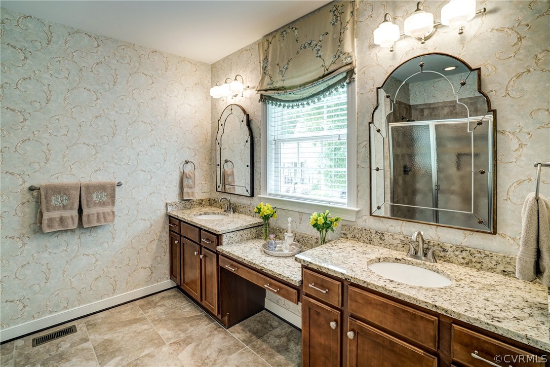 165 Button Bush Road Richmond, VA 23238 - Photo 30 of 50 a bathroom with double vanity sink and a mirror