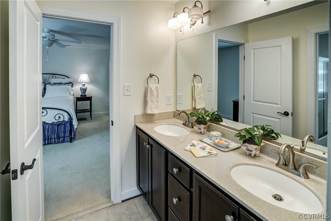 165 Button Bush Road Richmond, VA 23238 - Photo 45 of 50 a bathroom with a double vanity sink and a mirror