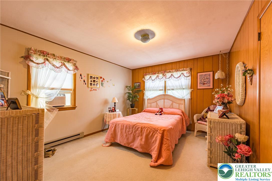 678 Interchange Road Kresgeville, PA 18333 - Photo 25 of 45 A comforting bedroom space featuring soft carpeting and a window offering natural illumination.