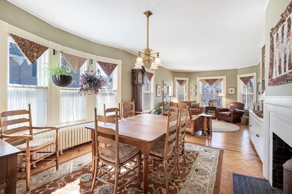 2 Clifton Park Melrose, MA 02176 - Photo 11 of 28 a dining room with furniture a chandelier and window