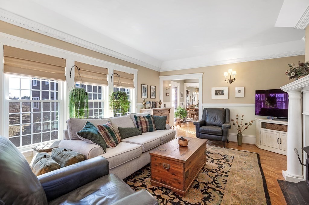 2 Clifton Park Melrose, MA 02176 - Photo 15 of 28 a living room with furniture a flat screen tv and a large window