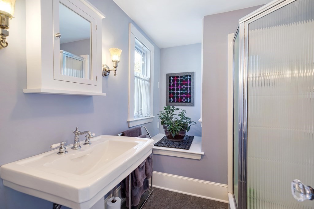 2 Clifton Park Melrose, MA 02176 - Photo 19 of 28 a bathroom with a sink vanity and a mirror