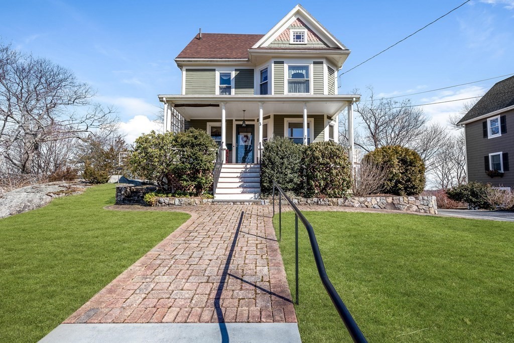 2 Clifton Park Melrose, MA 02176 - Photo 2 of 28 a front view of a house with a yard