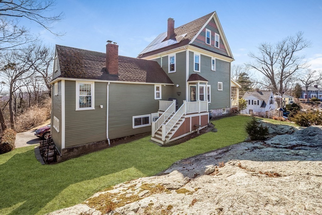 2 Clifton Park Melrose, MA 02176 - Photo 3 of 28 a front view of a house with garden