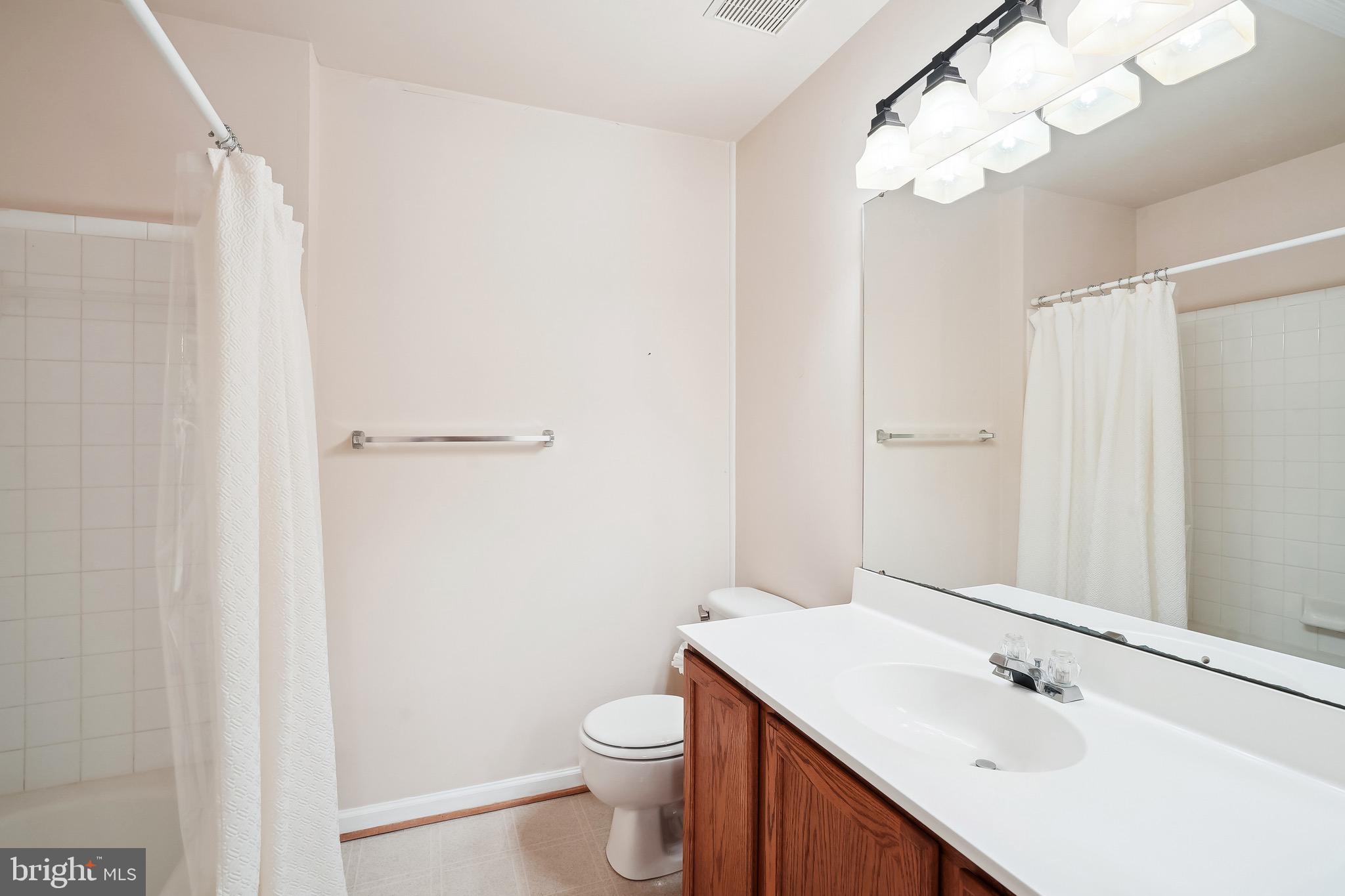 15761 Viewpoint Circle Dumfries, VA 22025 - Photo 21 of 46 a bathroom with a sink a toilet and shower