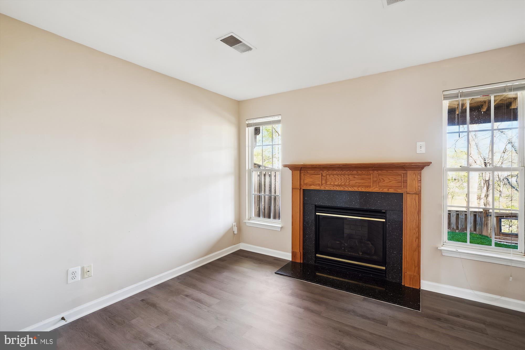 15761 Viewpoint Circle Dumfries, VA 22025 - Photo 23 of 46 a view of a livingroom with a fireplace and wooden floor