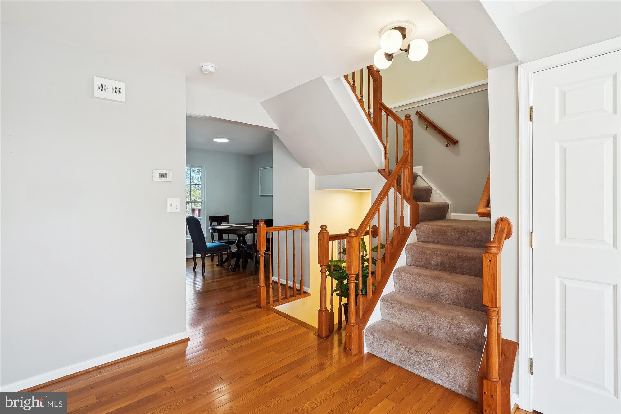 15761 Viewpoint Circle Dumfries, VA 22025 - Photo 10 of 46 a view of entryway and dining room with wooden floor