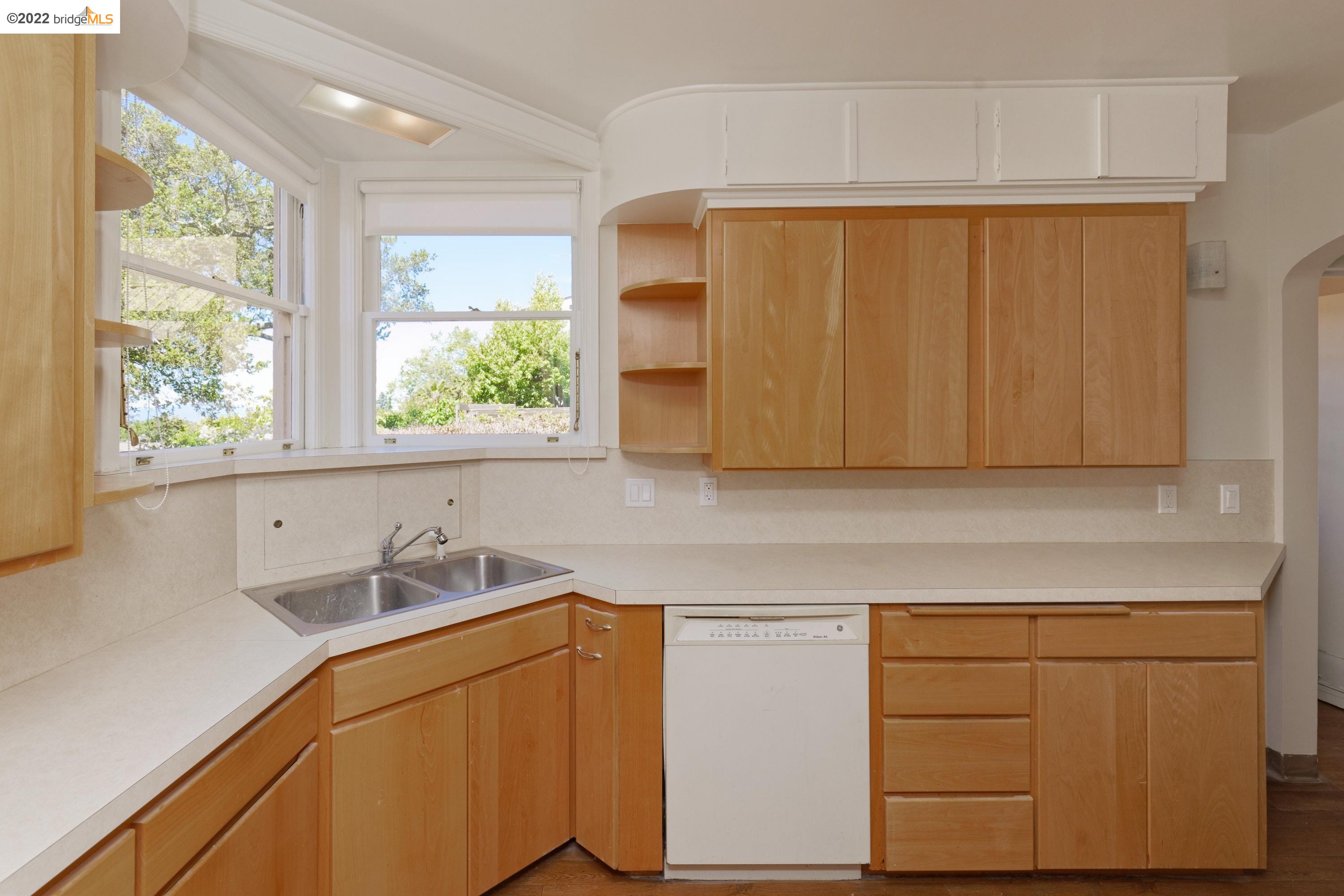 920 Spruce Street Berkeley, CA 94707 - Photo 12 of 36 a kitchen with a sink and cabinets